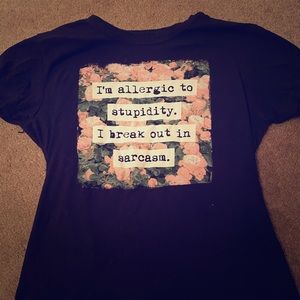 A black shirt with a quote in the middle